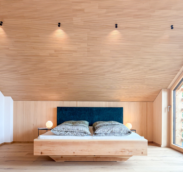 Holzhaus in Holzkirchen mit Schlafzimmer aus Weißtanne